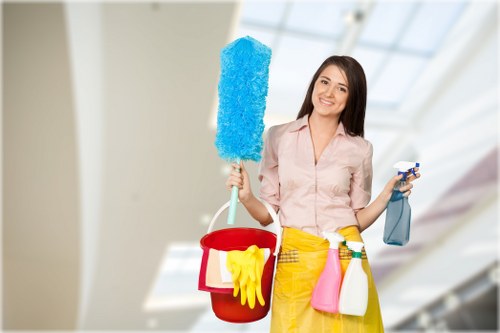 Cleaner using protective equipment during routine work
